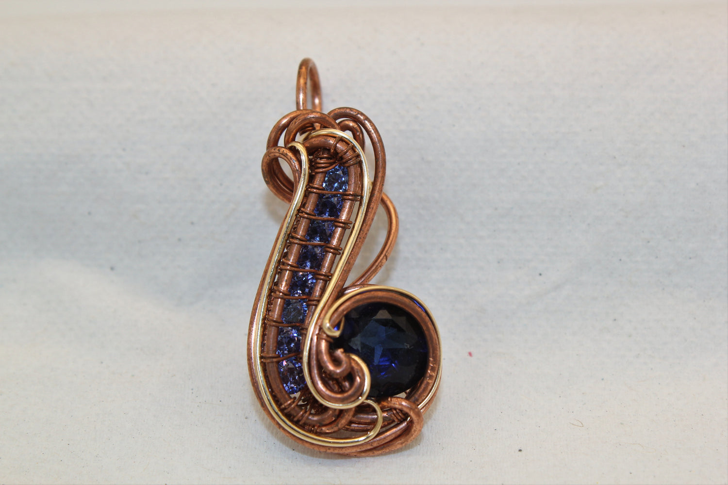 Wirewrap Synthetic Blue Sapphire Pendant With Gold