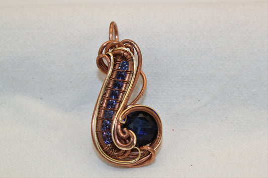 Wirewrap Synthetic Blue Sapphire Pendant With Gold